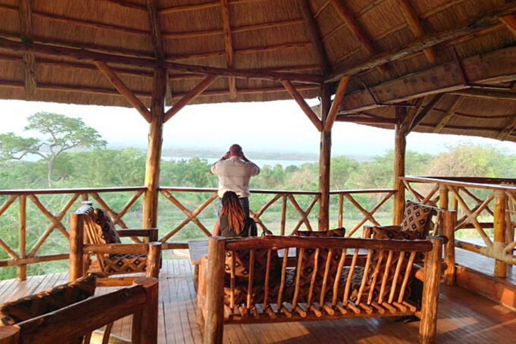 A guest enjoying views of the wilderness at Murchison Elephant View Hotel, Murchison Falls National Park.